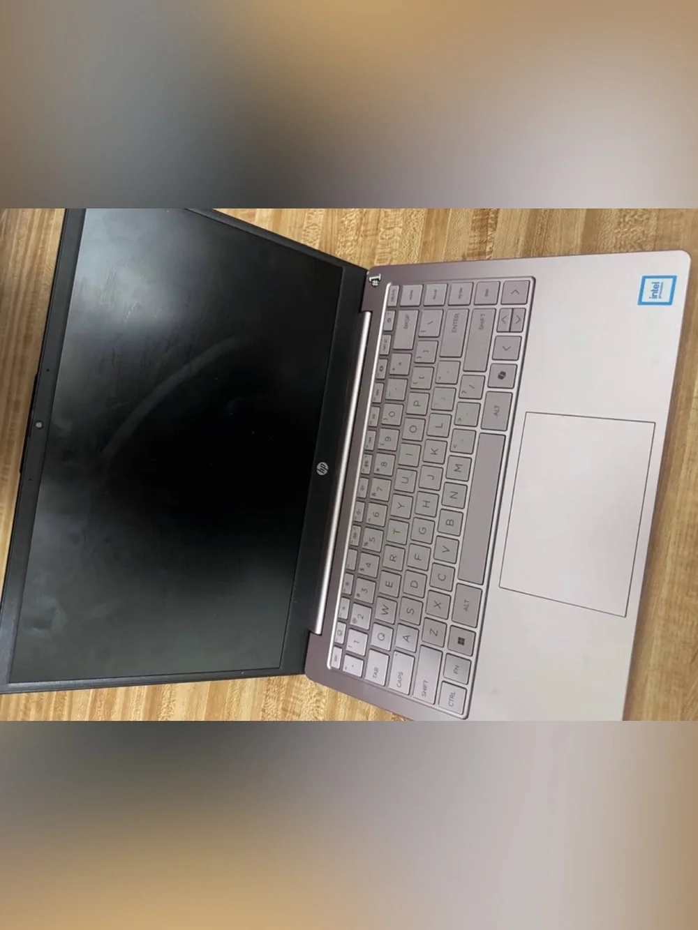 HP Silver Laptop with Purple Display Accent